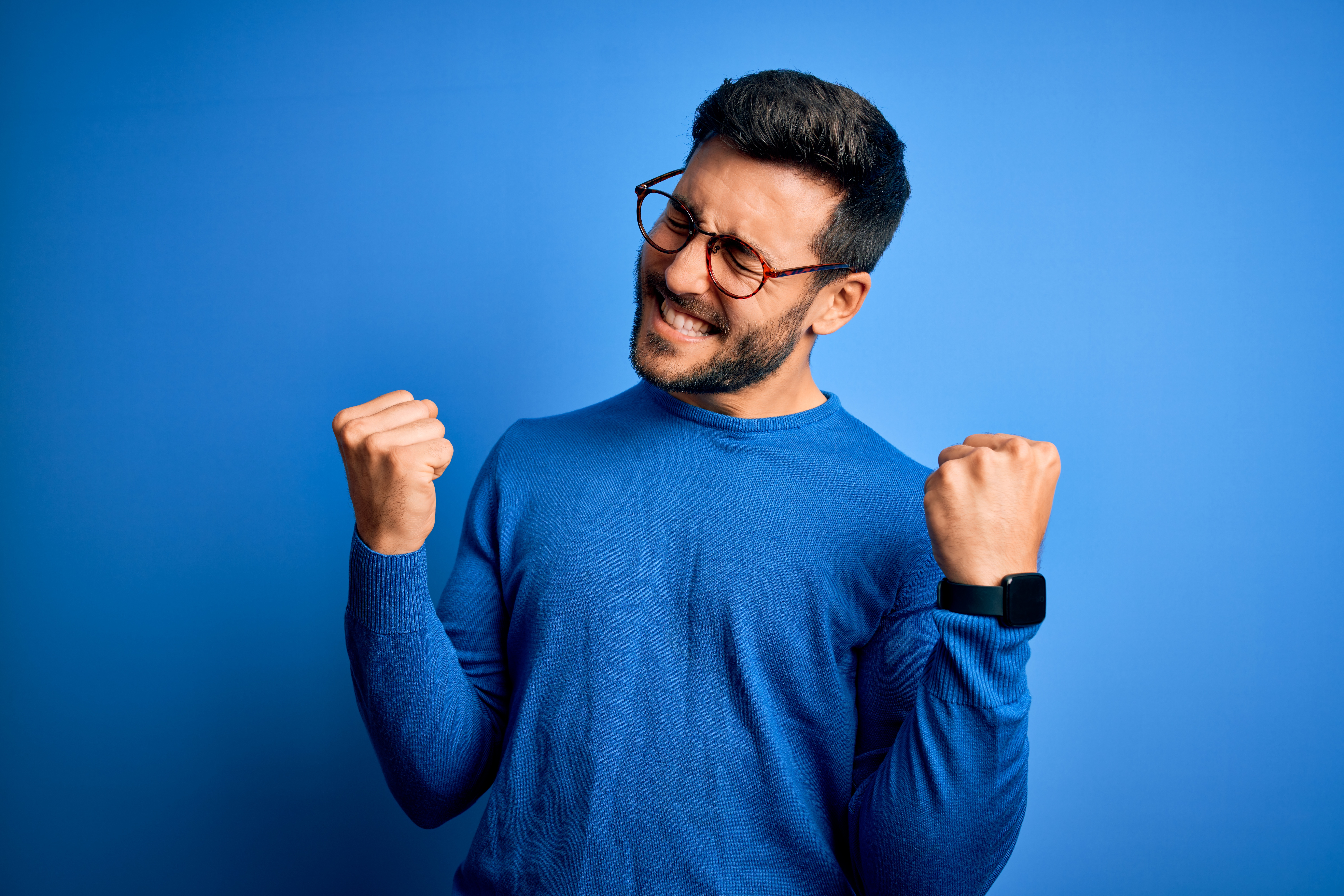 Young,Handsome,Man,With,Beard,Wearing,Casual,Sweater,And,Glasses